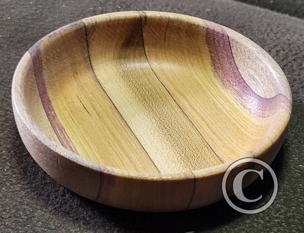 Striped bowl with purple accents